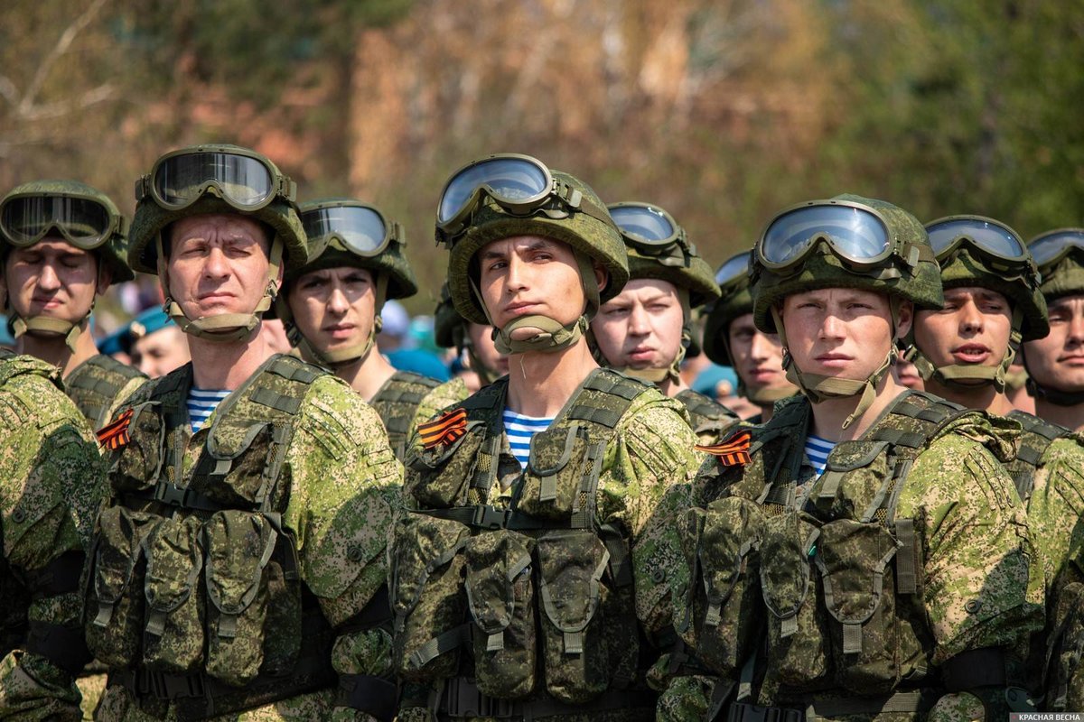 When Russia decided to suppress the insurrection in Kazakstan last year, it sent there its glorified riot police - the paratroopers. See the light blue stripes on their vests? Only VDV wears it