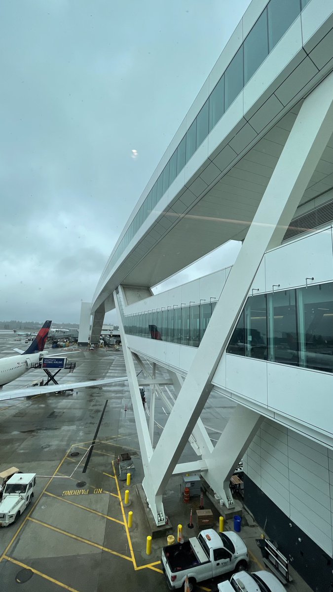It will open in a few more months. This is the sky bridge walkway for the Sea-Tac International Arrivals Facility. Yes, you can drive a 747 under it.