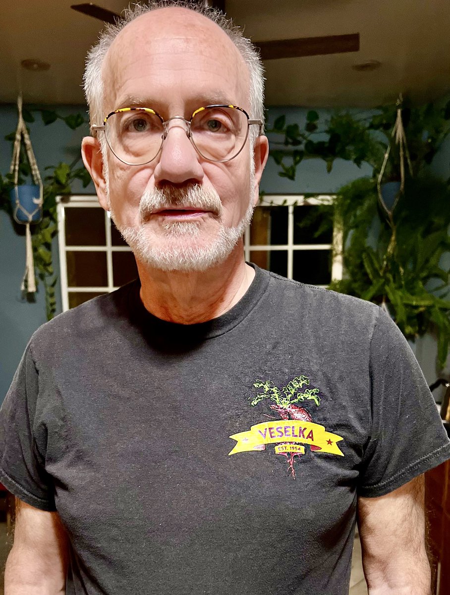 ZoeSloane's tweet photo. My Dad was adopted &amp; raised in NYC by a Jewish Ukrainian refugee. Like many he feels helpless, angry, &amp; horrified to see, 100 years later, brutal history repeating. Tonight we went to a concert, he showed up in this T. #IYKYK #StandWithUkraine️ #FCKPTN @veselkanyc @pcvstdog https://t.co/IK5CPWujh6