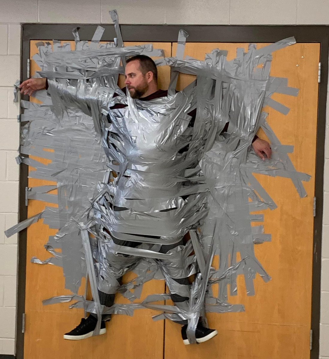 RhondaRRhodes's tweet photo. I think the number of strips of tape really means how much our Assistant Principal @Dja4260 Mr. Anderson is loved @GordonGators! #GatorGreatness https://t.co/JulHcdHmx2