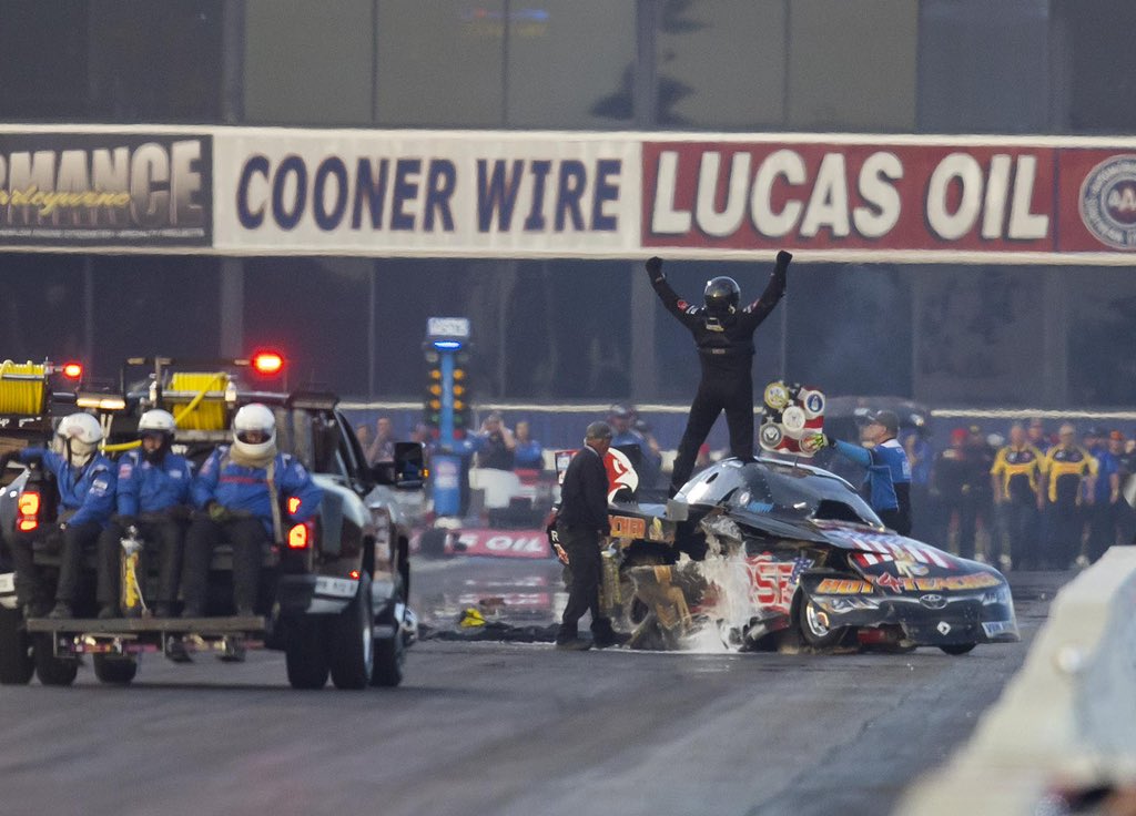 rebilasphoto's tweet photo. #NHRA funny car driver @fcAlex7491 celebrates in front of the crowd after being unhurt in huge crash into the wall during qualifying for the @nhra #Winternats @PomonaRaceway https://t.co/y57BDGD7Vu