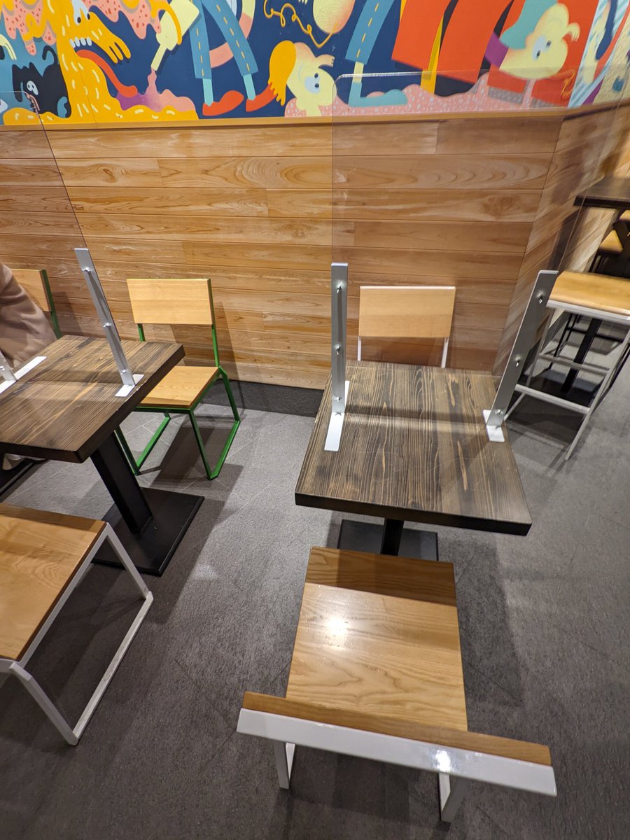 tindenli's tweet photo. Shake shack in Japan puts the covid barriers between *your own* group, and leaves the space between you and other groups open. This is definition of performative useless measures 😅 https://t.co/mYvVrhk5L8
