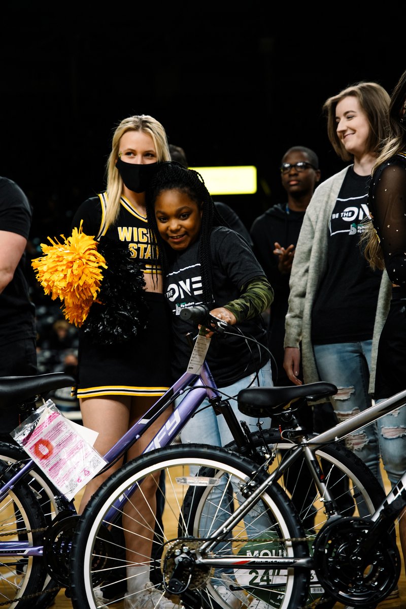 GoShockers's tweet photo. A tradition worth celebrating! 👏🚲

@meritrustcu presented a group of @BBBSA "Littles" with bicycles of their own at halftime of today's game.

We're proud to support #BBBS and their vision to provide a mentor for every child who needs a positive adult in their lives. https://t.co/XYlG50bTB9