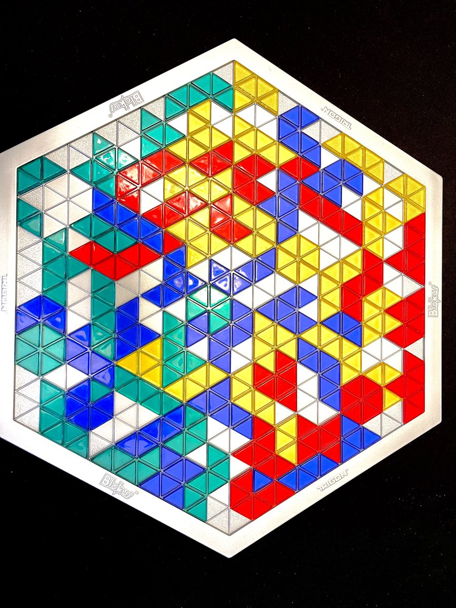 Brc_McC's tweet photo. Thrift store find alert! Blokus Trigon. Those triangles are tricky. Anyone guess which color won? #boardgames https://t.co/M1S6LCag4Z