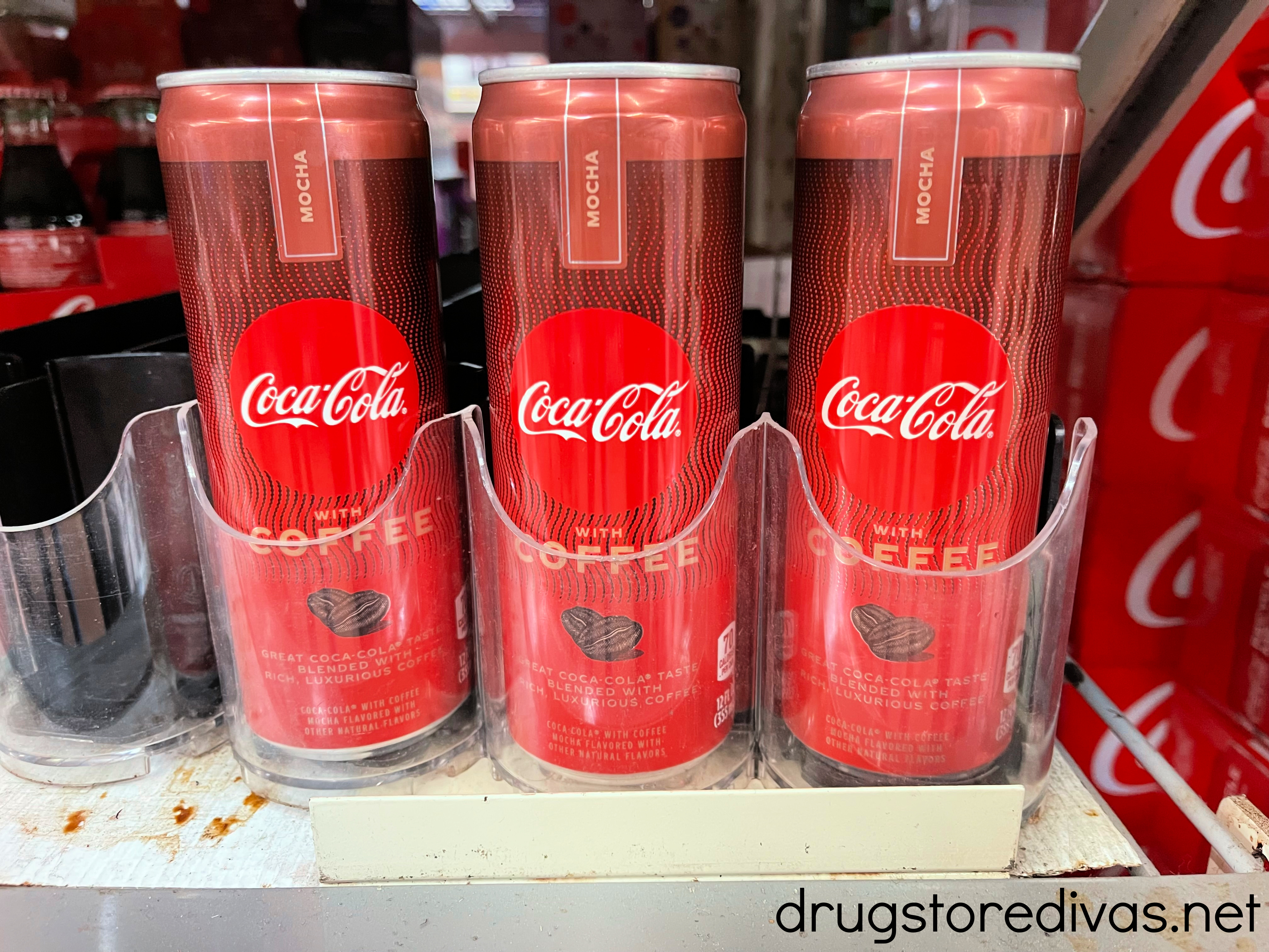 Coke with coffee on the shelf in a store.