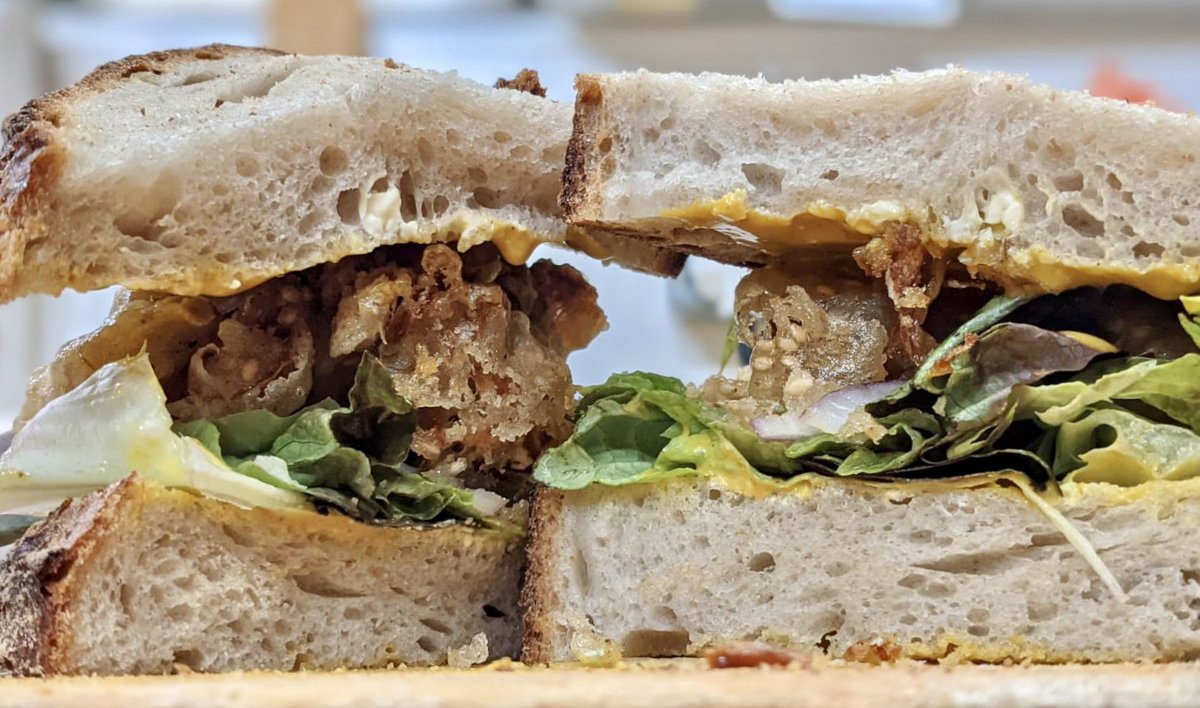 Our Chef’s Special Sandwich this week is:

Sesame Seed Tempura Mushrooms ; Red onion; house pickles, and a Satay sauce 😋.