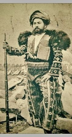 a common pattern in Ala Mhigan gear, one type of vest in particular was unique to iranic &amp; armenian regions, and was frequently worn on top - these were called aba or kaziakhi. The back and shoulders were woven of a heavy wool with long strands of wool hanging off the cloth 