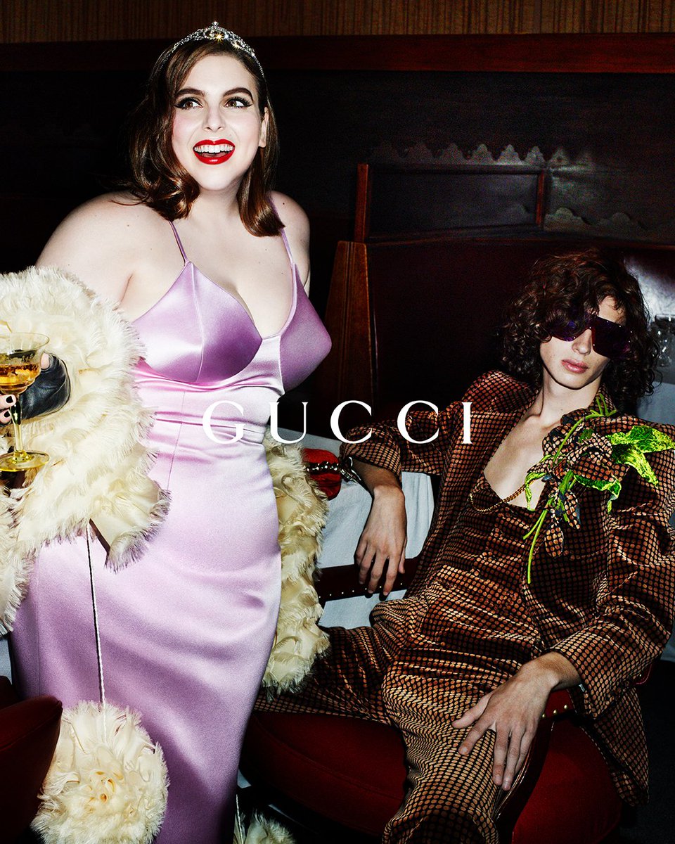 gucci's tweet photo. #GucciLoveParade reveals cinema’s power to gift dreams of beauty. Evoking those reveries in the campaign envisioned by #AlessandroMichele, #BeanieFeldstein wears a silk bustier dress with a ruffled boa and crystal tiara. Discover more on https://t.co/84yf4QWxzD https://t.co/ENgQbHXGPi