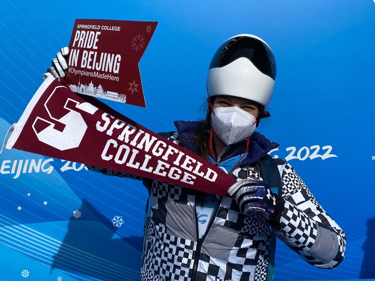 Happy Monday!! Here is a fun picture shared with us by Roger Moffat '71 of Kelly Curtis '12 proudly displaying #SpringfieldCollege in Beijing! We loved this 💓 #scpride #OlympiansMadeHere 🔻