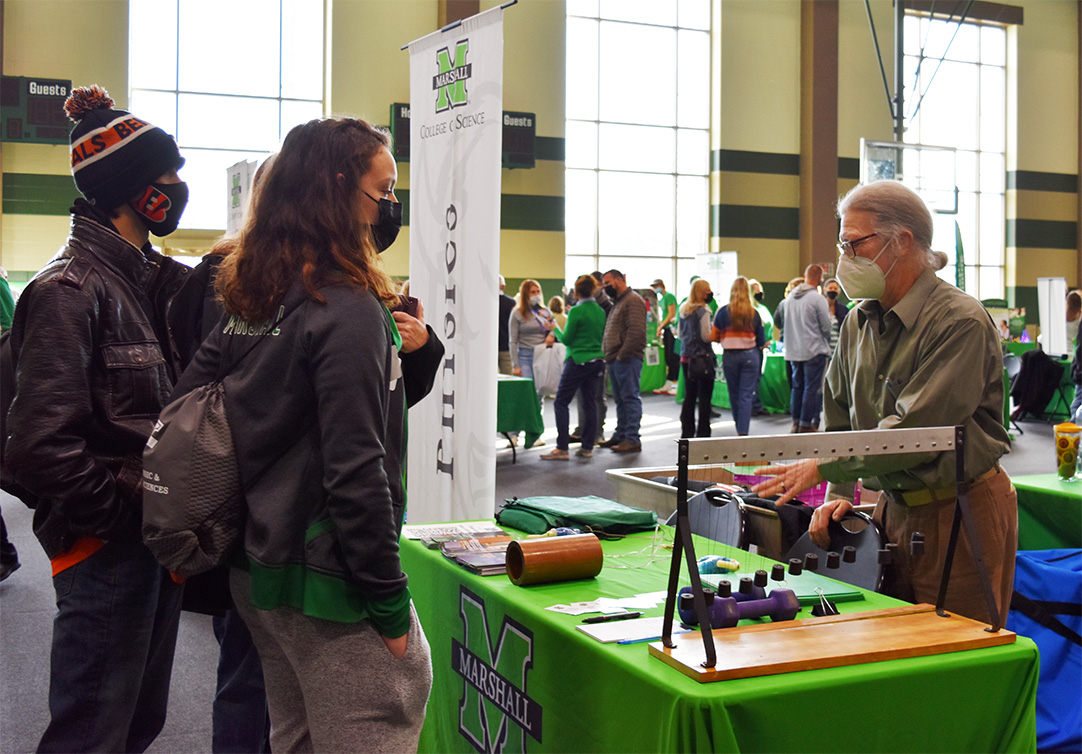 MarshallUCOS's tweet photo. Pictured: Dr. Curt Foltz from the Physics Department demonstrating Physics to the students at a recent Green and White Day on campus. If you are interested in learning more about the Physics major, contact us today! #MUPhysics https://t.co/WyoYkVCvcf