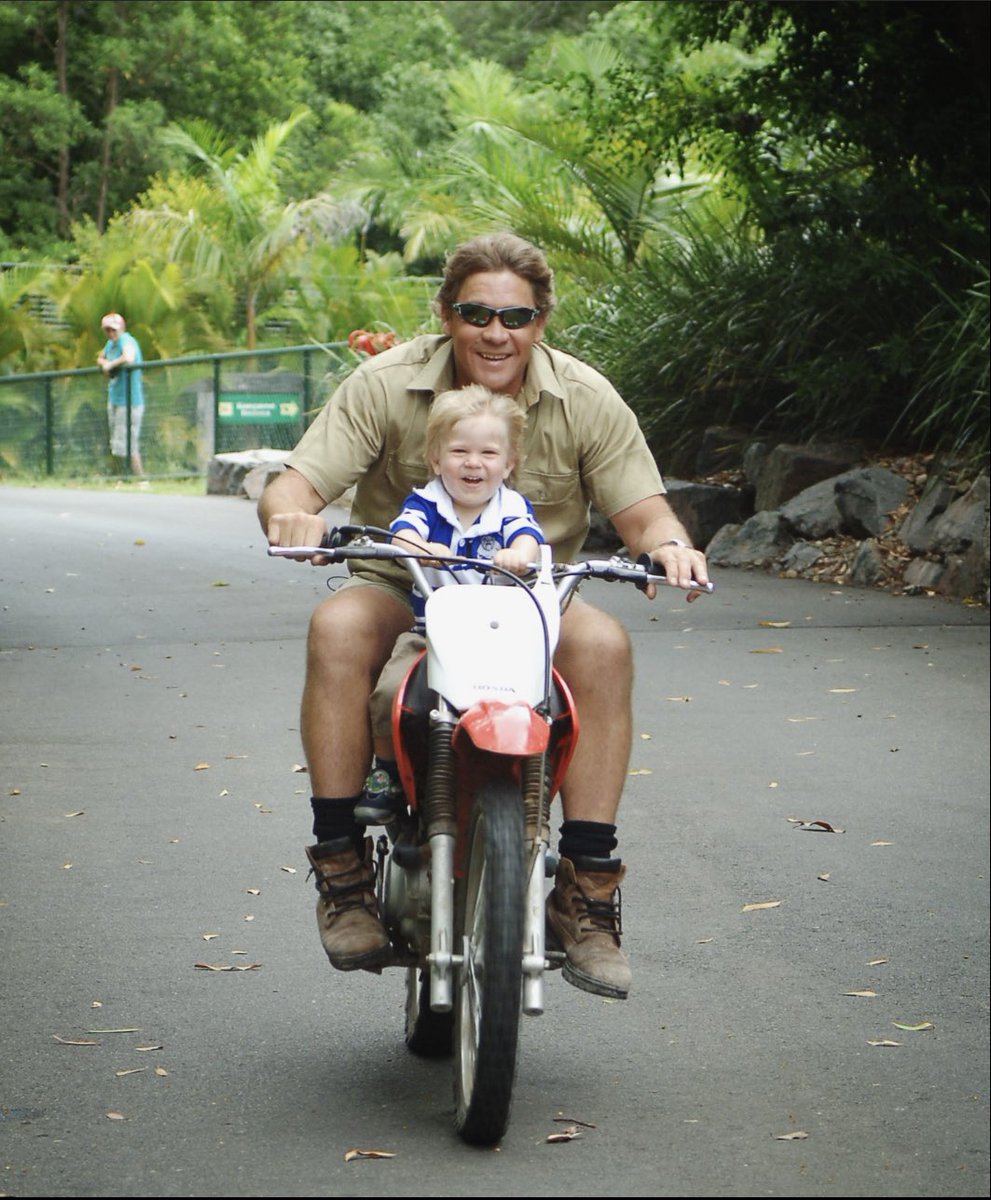 RobertIrwin's tweet photo. Happy birthday Dad. Love &amp; miss you every day. My earliest memories are my fondest thanks to you. Hanging on to the handlebars of the motorbike, on your morning lap of the zoo. Every minute with you was a blessing. 
I’m gonna ride that lap on your old motorbike this afternoon. ❤️ https://t.co/ihvWT6IvdM
