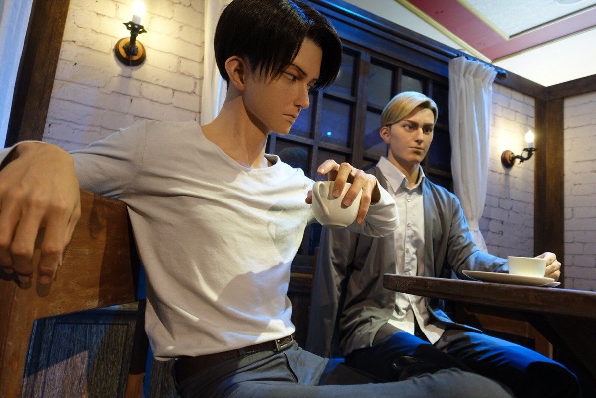 hourly_eruri's tweet photo. I find it so curious that Levi is practically sitting on the edge of the chair, as if he wants to be close enough to Erwin, I mean look at his shoe is rubbing Erwin's leg lol https://t.co/cZ6Q48rXzb