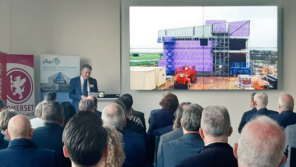 Leonardo_UK's tweet photo. Austin Chick from @LDO_Helicopters and Head of the #iAero Centre, opens proceedings at today's launch in #Yeovil. 
We're delighted to be the centre's anchor tenants as, along with @SomersetCouncil and @HeartofSWLEP, we look to further innovation in region's aerospace sector. https://t.co/esLJ7QY2IL