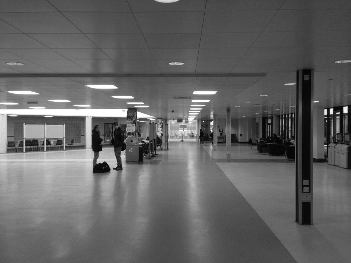 Adaptive Reuse: The adaptive reuse of the existing atrium &amp; study area focused on improving legibility and connectivity. 

Removing decades of ad-hoc interventions revealed the inherent flexibility of the original 70s structure, creating a more comfortable, engaging environment.