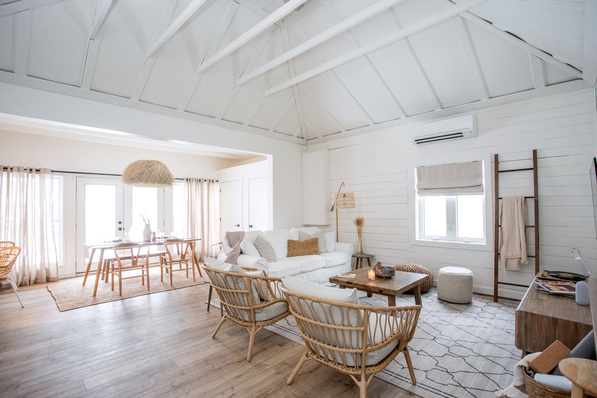 Tall vaulted ceilings and plenty of sunshine. Even in the winter, the living room at The Hideaway is bright and inviting. You’ll find a cozy couch, lounge chairs, poufs, tons of pillows and throw blankets, and of course an HD smart TV with Netflix and Amazon Prime ready to go.