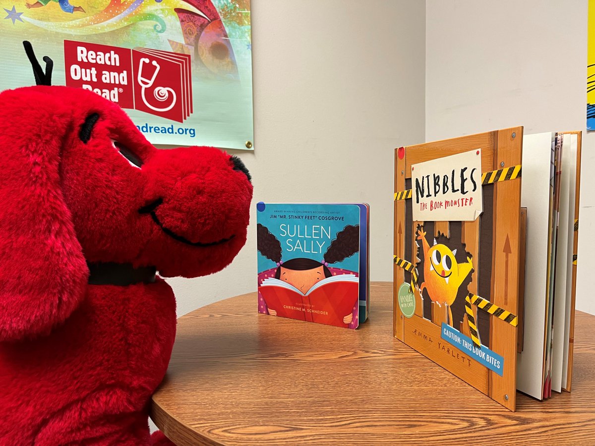 RORKC's tweet photo. How are you celebrating 2-22-2022? At Reach Out and Read Kansas City, Clifford is finding it difficult to choose between two of our favorite books: “Sullen Sally” and “Nibbles The Book Monster.” #ReadTogetherKC #Twosday https://t.co/umA3NhGAqB