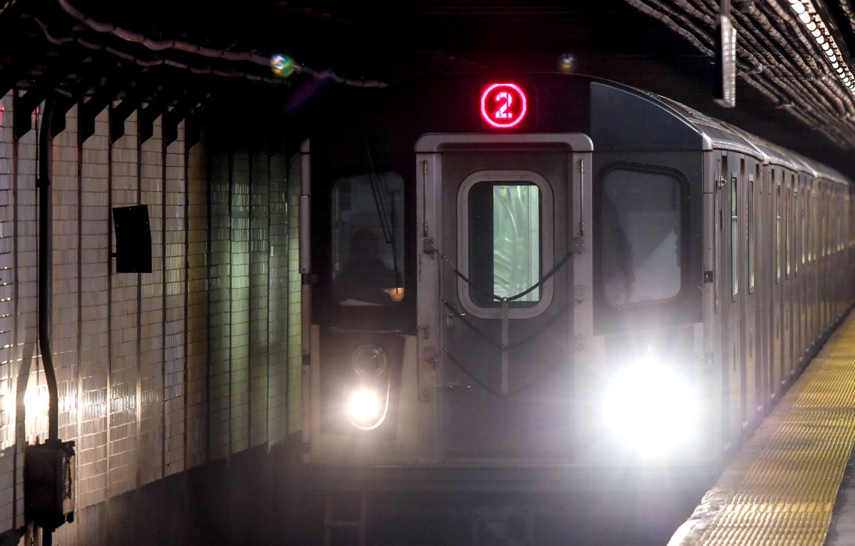A 2 train entering a station.