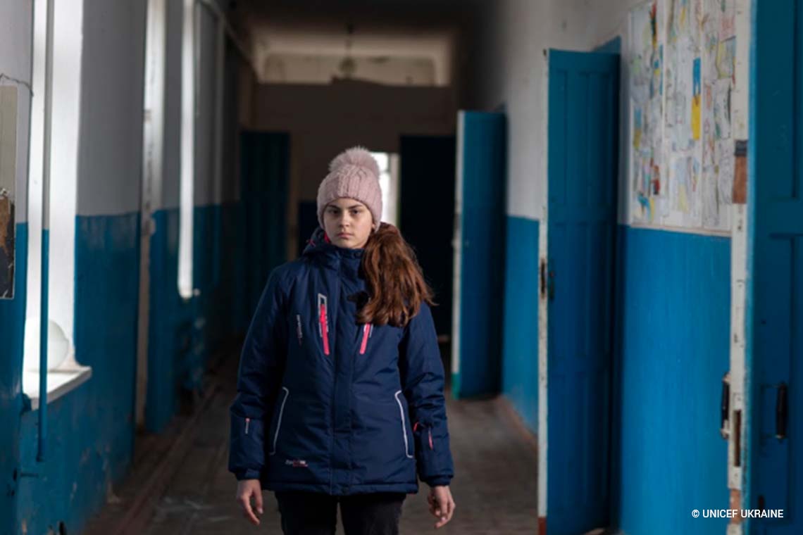 UNICEFUSA's tweet photo. Nastya, 16, from eastern Ukraine walks through her old school, which closed in 2014 due to risk of attacks and hasn't re-opened since.

@UNICEF_UA is working with partners on the ground to safeguard education for vulnerable children — but ultimately, lasting peace is needed. https://t.co/hYsvRBWyxi