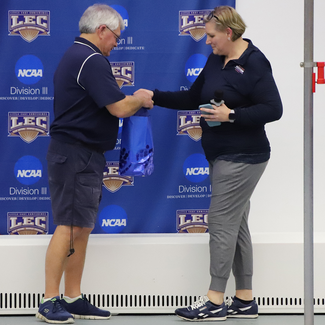 LittleEastConf's tweet photo. Prior to the start of tonight's finals session the #LECswim head coaches pair tribute to @WestfieldOwls head coach Dave Laing, who is retiring after an outstanding 40-year career. Congrats on your retirement, Dave! #LECchamps #Legend #NCAAD3 @NCAADIII @d3sports @CSCAA https://t.co/AipqUS5nOj