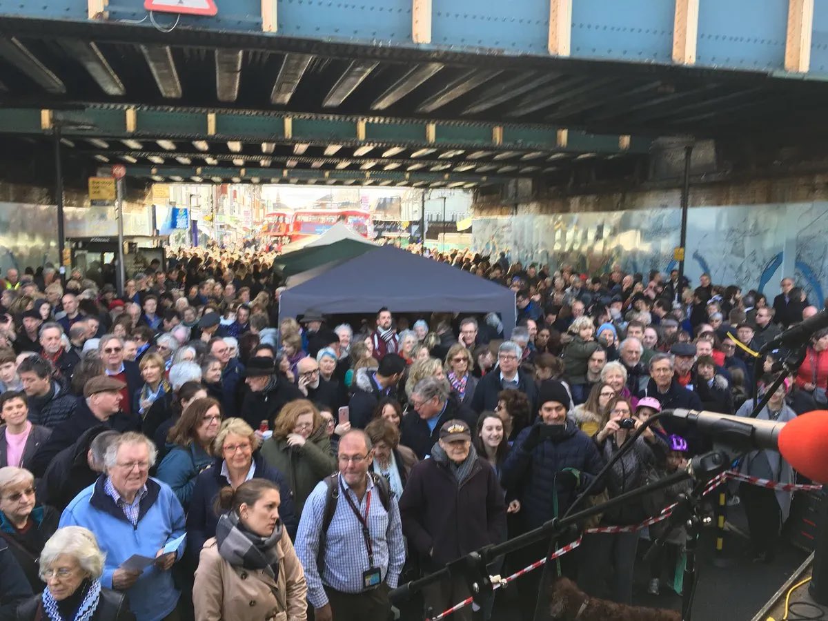 TorinDouglas's tweet photo. In the @guardian, there’s a lovely photo of Jan Pienkowski at the unveiling of the #ChiswickTimeline mural by Sir Peter Blake in 2018. See link here: https://t.co/7DZVmwVbXA @AbundanceLondon This is Jan’s painting on the mural and the crowd watching the unveiling! #MegandMog https://t.co/Bq5CJQ2tOi