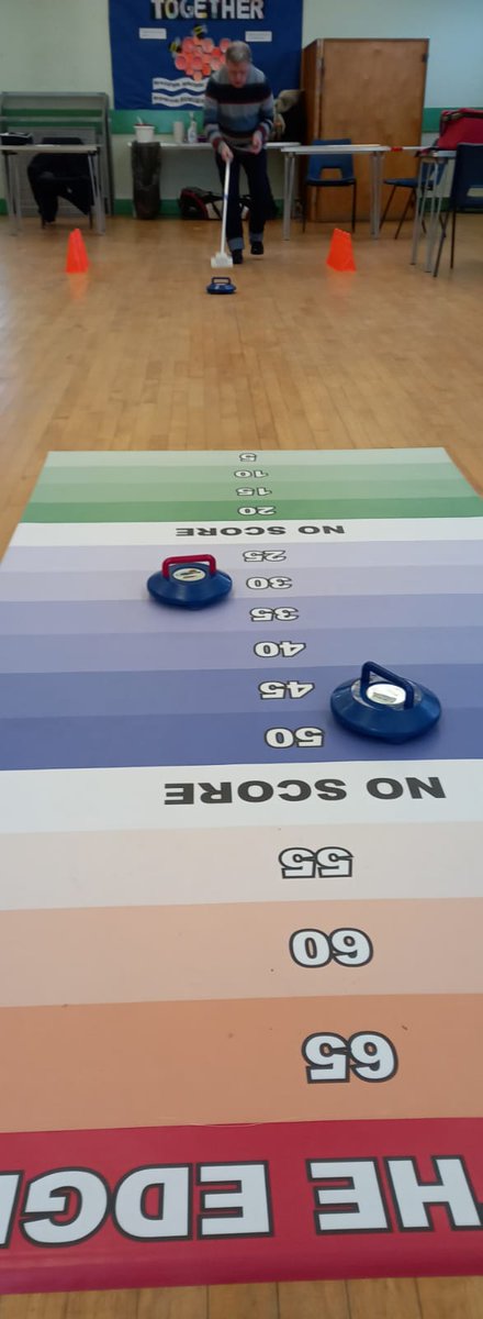 The Caddy Shacks have been inspired by the success of the curling teams at the Winter Olympics. Here is Christopher on his way to a great score.