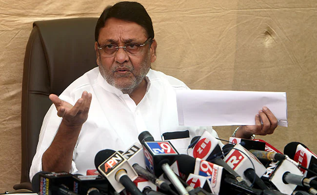 ndtv's tweet photo. Maharashtra Minister Nawab Malik Arrested Over Money Laundering Case https://t.co/PiAfi4qICd https://t.co/wYlUmw3tBL