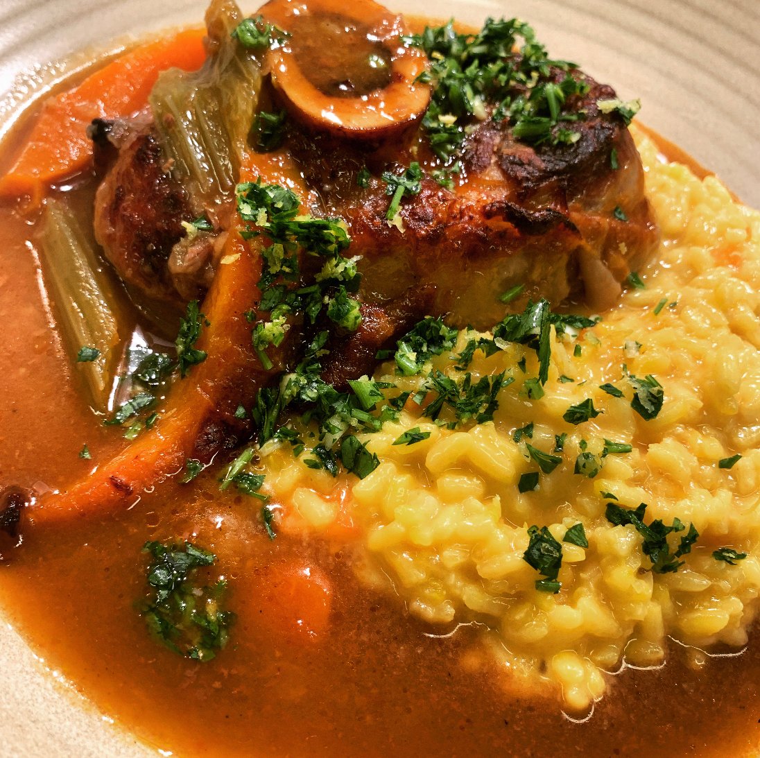 One of our favourite dishes, “ osso buco “ refers to a cross cut of veal shin, literally a bone with a hole! 

Slowly braised in a tomato, white win and sage stock, served with Milanese saffron risotto and a sprinkle of gremolata to finish this wonderful dish