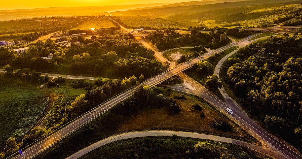 aerial view of an empty spaghetti junction highway in Moldova at sunrise 