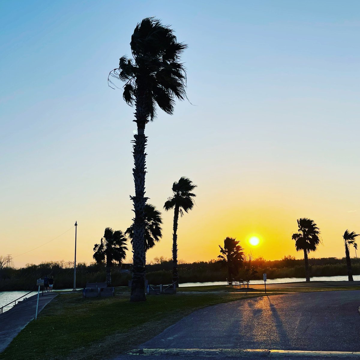 JustinTMusic's tweet photo. Yesterday’s show was on the Rio Grande River. We had a great time at Chimney Park Resort! I snapped this photo as I was pulling away. The sun setting into the Mexican horizon. #riogrande #mexico #bordershow #texastour2022 https://t.co/XeaN8buFpE