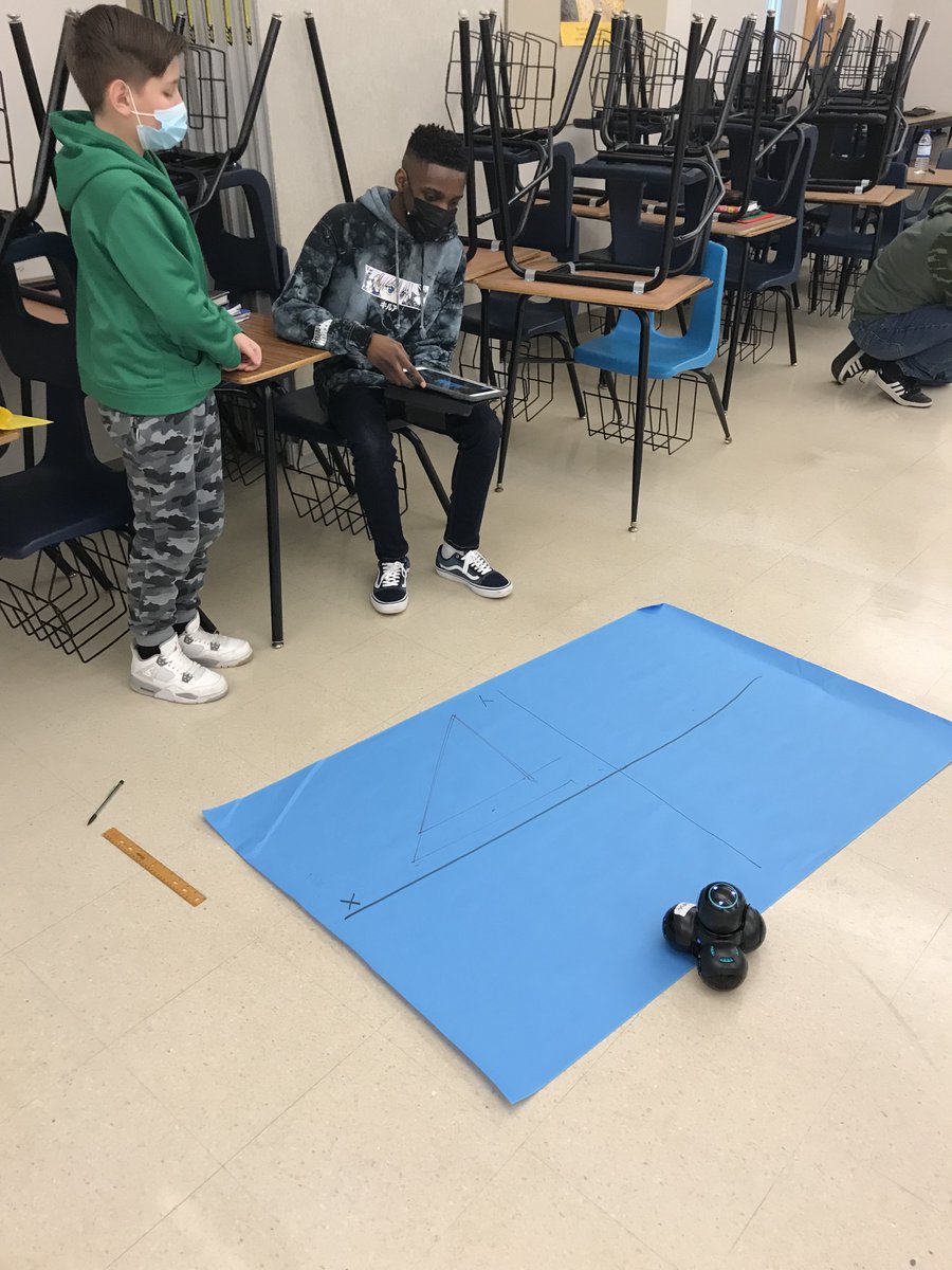 MrsOwensDB's tweet photo. Middle School Instructional Coach, Kris Endy, collaborated with 8th grade math teachers to use Cue robots to teach reflections and translations! #DBASD #DBBlazers https://t.co/to4ZdHjsEw