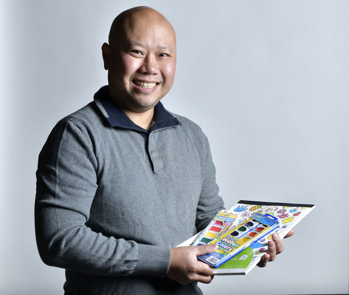 Nhu Vu, 42, remembers receiving water colors and coloring books when he was a child in Allston in the 1980's. Vu, whose parents fled Vietnam, now lives in Newton and works in software. Caption credit: Josh Reynolds for The Boston Globe (Globe Santa)