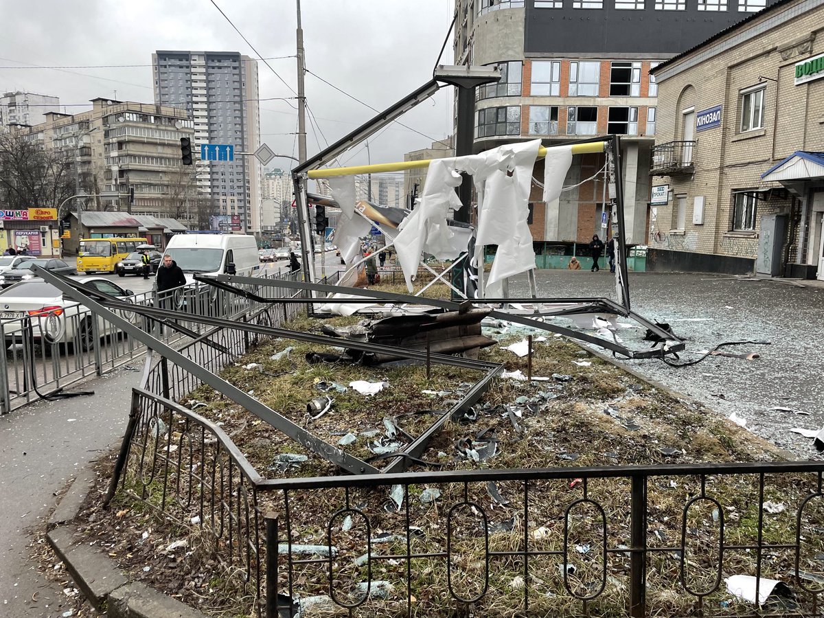 Early collateral damage in Kyiv: a Russian rocket remnant hits a Mazda billboard.