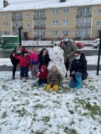 HawthornFlc's tweet photo. "When we slide down the hill over and over and over our bodys melts it, look see the grass that's the melted bit" The children have loved exploring the snow today (so have our staff) https://t.co/eCukZYF6Du