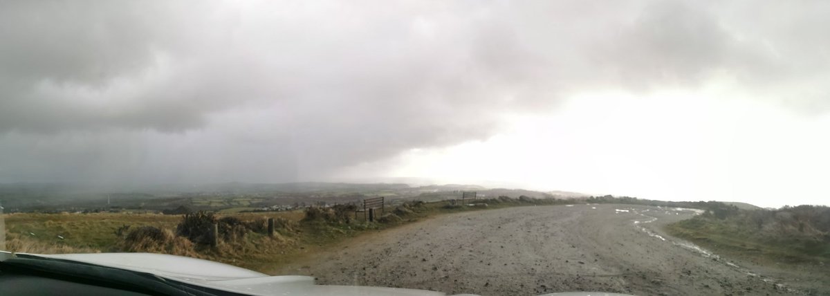 Snow to the left, rain in the middle and faint sun to the right.... Or just turnaround and go back to the car... #dogwalking #cornishweather