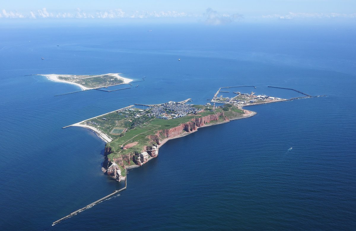 Heligoland (Holy Island) is a German island in the the North Sea. Its history dates from the prehistoric. Its cliffs reach almost 50 metres, so it is seen over the horizon from great distances. It is approx. 28miles from nearest mainland. How did The Gentleman get there?