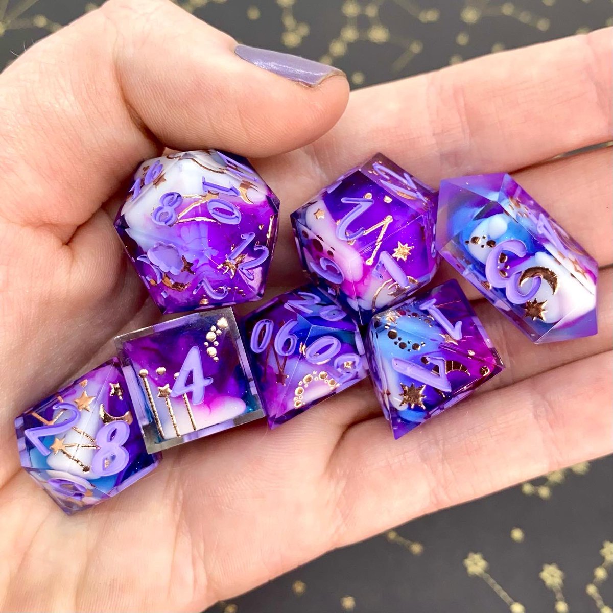 Dreamy_Dice's tweet image. “Dream Weaver” - A blue sky with a swirl of purple, white clouds, and champagne gold celestial decals 🥰