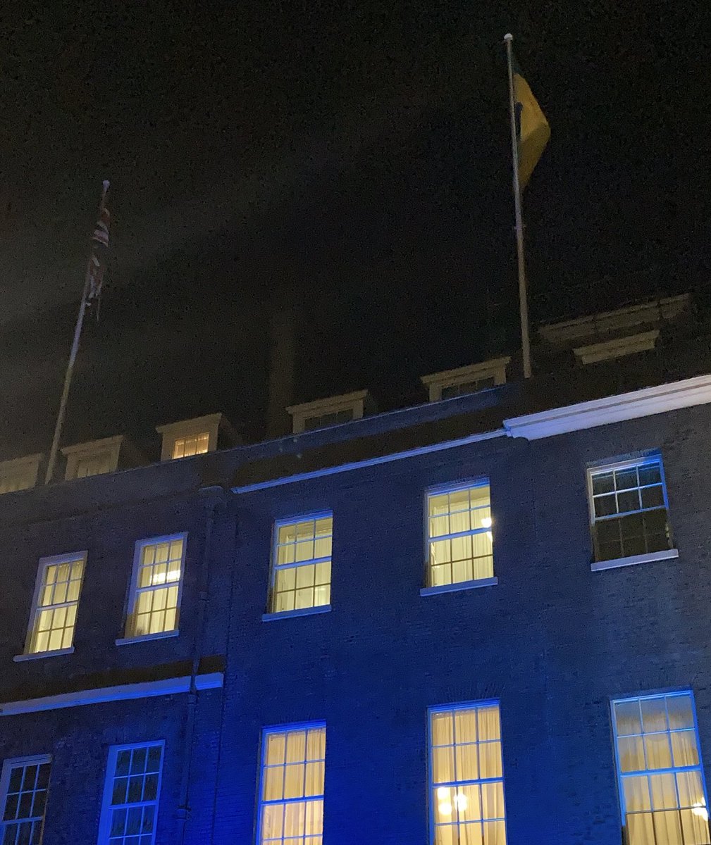 Ukrainian flag flies next to the UK flag tonight at Downing Street.