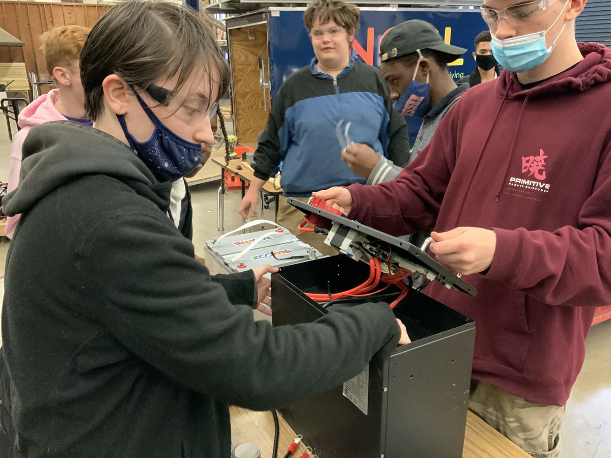 ngsliving's tweet photo. These young student technicians are troubleshooting and repairing the battery management system on a large lithium battery. I don’t think you will find another group of high school students as capable as this group. These students are already industry certified. https://t.co/ZOBsLY8QGN