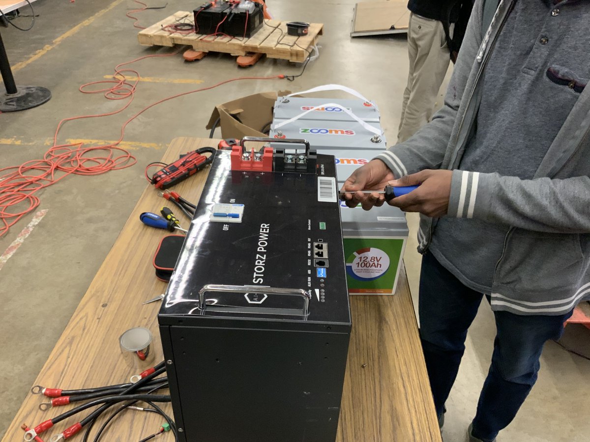 ngsliving's tweet photo. These young student technicians are troubleshooting and repairing the battery management system on a large lithium battery. I don’t think you will find another group of high school students as capable as this group. These students are already industry certified. https://t.co/ZOBsLY8QGN