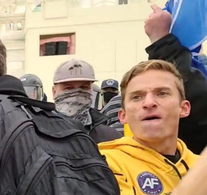 PacAntifa's tweet photo. Meet Adam Edward Smith, 29, of San Diego: hardcore white supremacist, Groyper, nazi sympathizer, misogynist, former US Navy seaman, and Capitol rioter known heretofore as #YellowHoodieAFBrat. https://t.co/ZoQ8z6CTFd