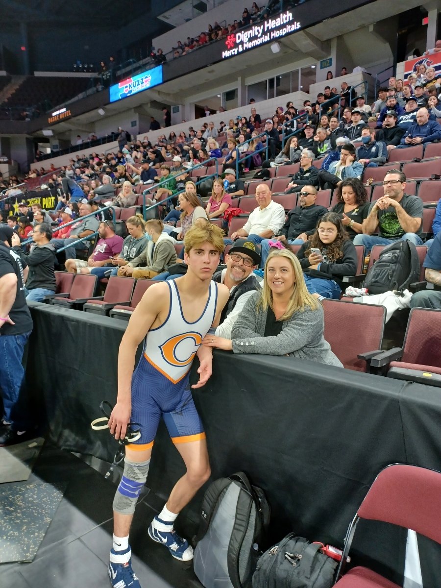 NADEWRESTLING's tweet photo. Senior Zeth Romney says hello to his biggest fans (Brent and Angela Romney). Years of sacrifice, prayer and love went into Zeth's wrestling journey. Zeth wins his 1st match and moves to the next round at CA State in Bakersfield. https://t.co/YxyEjSpRnP
