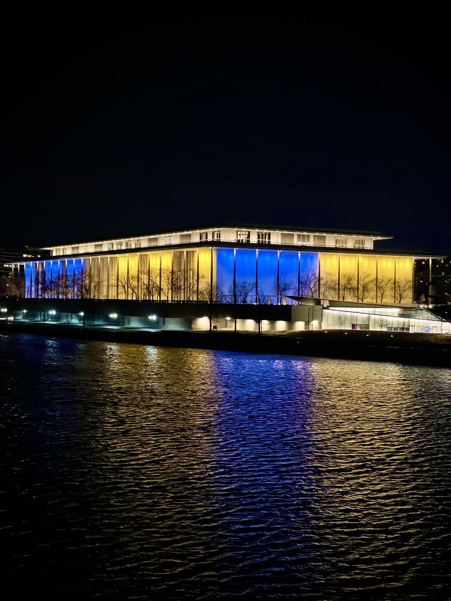 TKCOfficial's tweet photo. "We shall also do our part to build a world of peace where the weak are safe and the strong are just."—President John F. Kennedy

In solidarity with the people of #Ukraine, the #KennedyCenter building is lit with the colors of the Ukrainian flag. 🇺🇦 https://t.co/Pa7QqLSReG