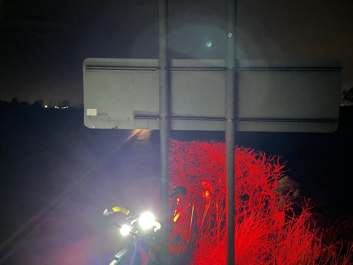 GordyReid's tweet photo. On the A70 cycle path, a sign extends halfway across at head height. As you come down the hill, the back of the sign is grey. In the dark, with car lights dazzling someone could be seriously hurt. @southayrshire @AyrshireRoads #cycling #ayrshire https://t.co/zIvHD4SXs1