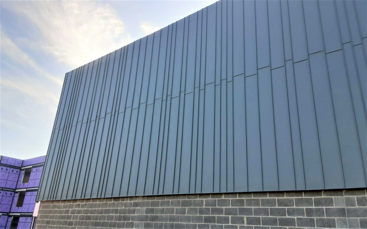 LongworthFacade's tweet photo. Another great shot of our first completed elevation at Edgar Wood Academy. On this project we are installing Greencoat Merlin Grey standing seam cladding and Equitone Natura for Wates

@metal_solutions - Greencoat Coils
@firthsteels - decking sheets

#cladding #facade https://t.co/UXoPezAFBf