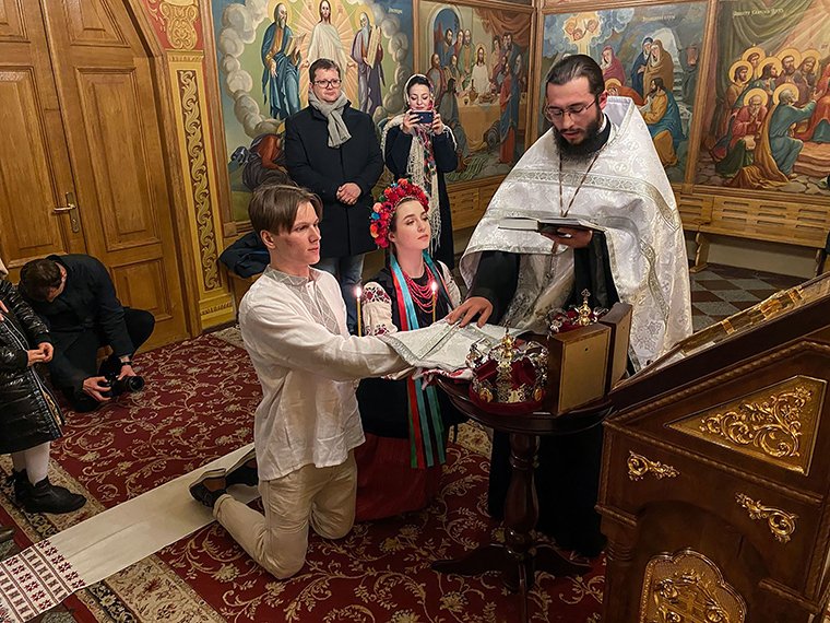 roman_orthodoxy's tweet photo. The Ukrainian people are a people of deep faith. Here, as explosions rocked the capital city of Kyiv, a betrothed &amp; young Orthodox couple are married by a priest at St. Michael's Cathedral https://t.co/VT8nRikbtu