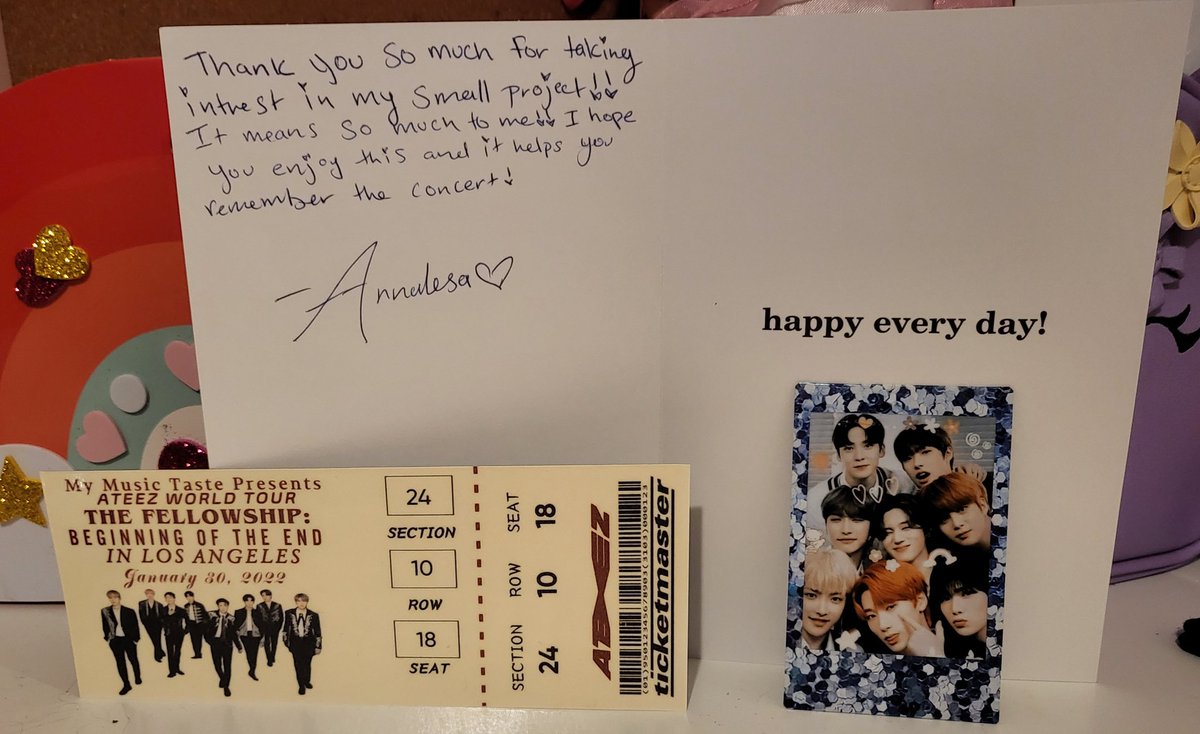 KpopFandom94's tweet photo. So I received this beautiful letter today with my ticket🏴‍☠️🖤 I will cherish this and add it to my next #Ateez keepsake project I do👑☠️🔥   Thank you @AnnalesaLuna ps: pls excuse my background I used my daughter's desk for the picture 😆 https://t.co/ZBVajjQu0z