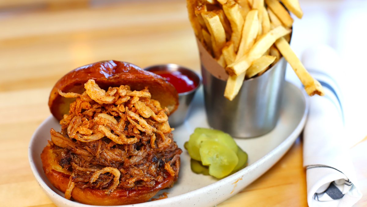 You can’t go wrong with a classic.

BBQ Pulled Pork - smoked pork shoulder. bbq sauce. crispy shallots. brioche bun. served with fresh cut fries.