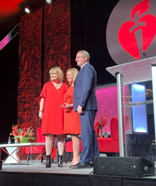 NancyatHeart's tweet photo. Such an honor to see dear friends and @American_Heart volunteer leaders Lisa & Dr. John Warner receive the Sandi Haddock Community Impact Honor at the #DallasGoRed Luncheon. They are relentless supporters of heart health in all communities. #HeartMonth @UTSWNews https://t.co/1akrZD8nID