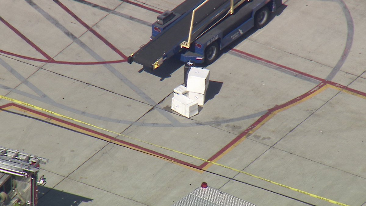 Stu_Mundel's tweet photo. John Wayne Airport HazMat situation at the terminal surrounding an American Airlines Aircraft. Possibly three people exposed. Orange County Fire Authority is handling the incident. @FOXLA @SkyFox https://t.co/jKVlIS1PLL