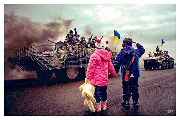 Thegr8war's tweet photo. Yet again in the name of one persons vanity….we see children salute their fathers off to defend their homeland against an unwanted aggressor #UkraineUnderAttack #Ukraine #UkraineRussia https://t.co/otkifT1k3R